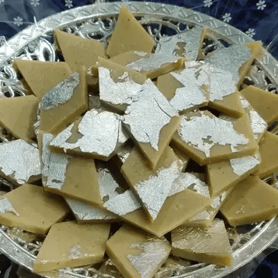 Premium Kaju Katli diamonds finished with edible silver leaf, photographed at our Khammam kitchen